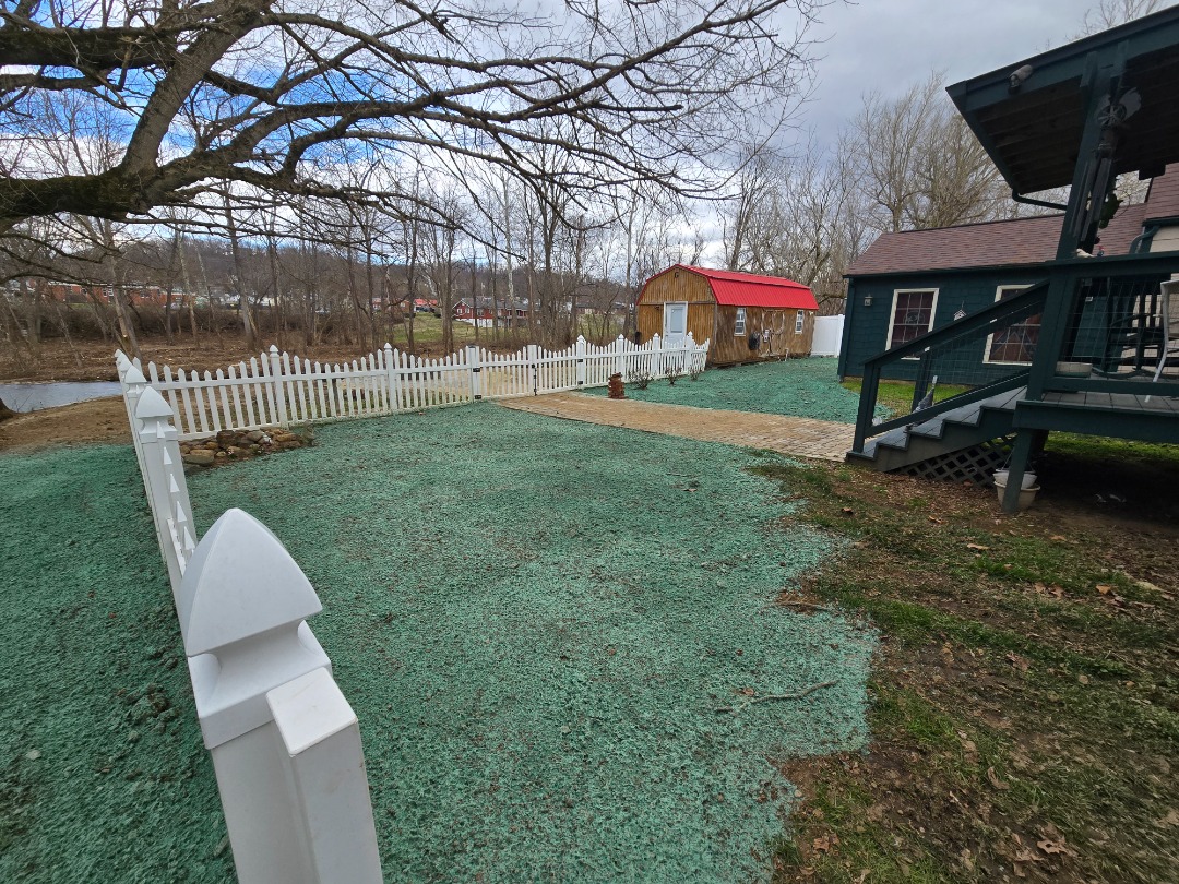 Hydroseeding being done on a happy client's yard.